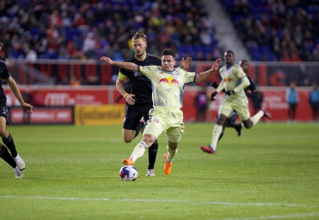 Red Bull striker Dante Vanzeir is fouled by Nashville captain Walker Zimmerman to set up a dangerous free kick.