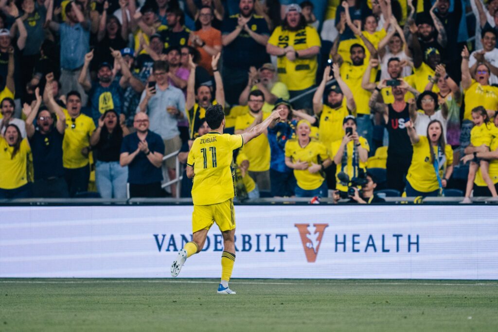 Zubak celebrating in front of nashville crowd