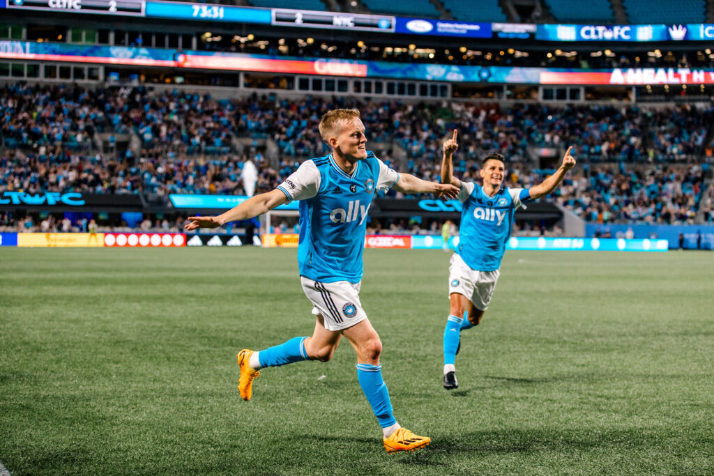 charlotte fc players celebrating goal