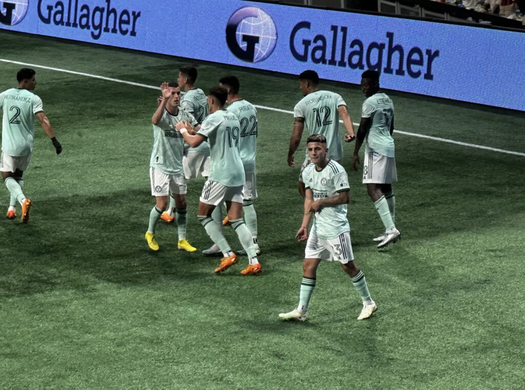 atlanta united players celebrating a goal