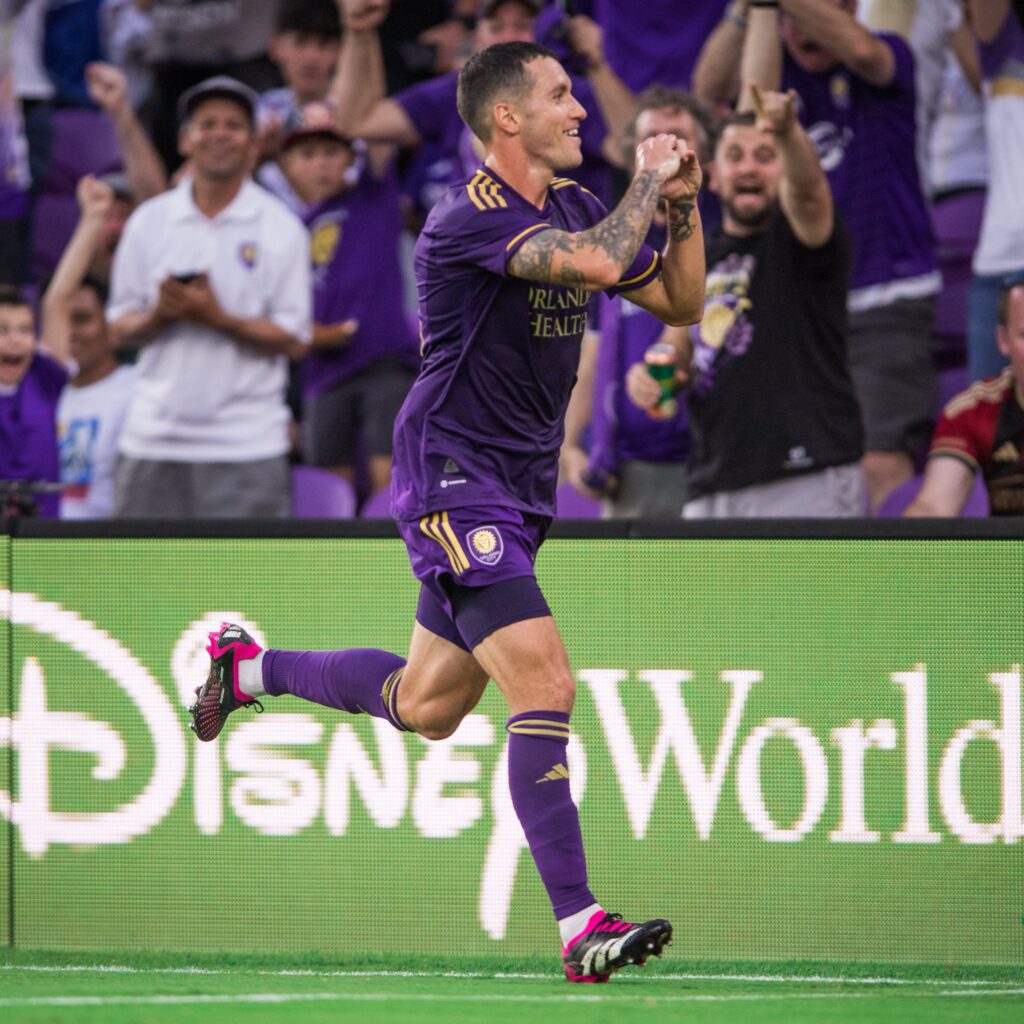 Kyle Smith celebrating his goal for orlando city